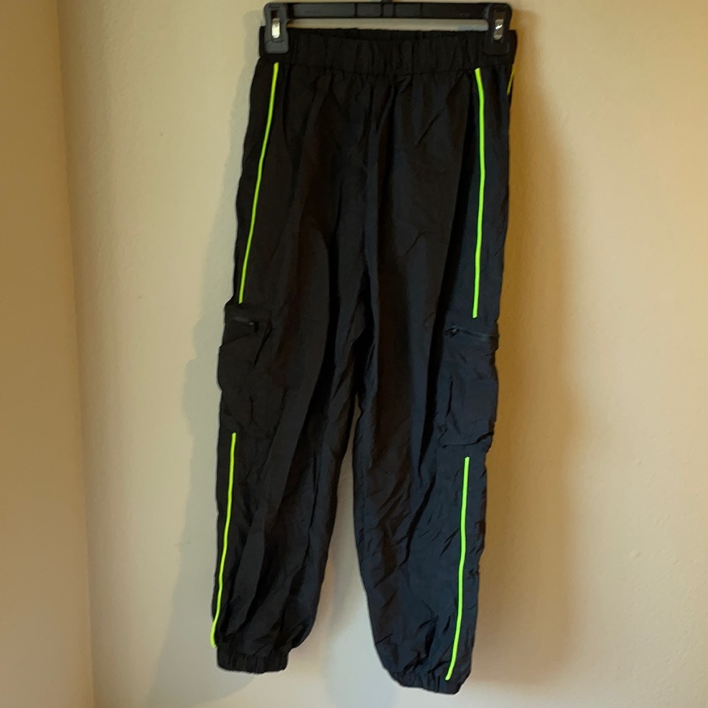 Black pocket patched pants with green stripes